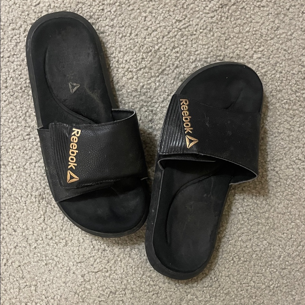 Reebok Black Slides with Gold Accents